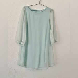 Mint green dress with sheer sleeves